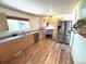 Modern kitchen with stainless steel appliances and wood cabinets at 3531 E 91St Ave, Thornton, CO 80229