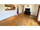 Bright living room features hardwood floors and a glimpse into the kitchen at 3531 E 91St Ave, Thornton, CO 80229