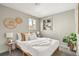 Inviting bedroom featuring natural textures, a built-in shelf, and a calming atmosphere for restful sleep at 3270 S Washington St, Englewood, CO 80113