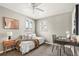 Bright bedroom with cozy daybed, modern furnishings, and natural light from two windows at 3270 S Washington St, Englewood, CO 80113