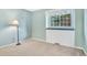 A serene bedroom with ample light, complemented by a floor lamp, creating a calm and inviting atmosphere at 10627 Chautauga Mtn, Littleton, CO 80127
