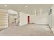 Open living space featuring a staircase and neutral walls, offering a versatile layout for various design possibilities at 10627 Chautauga Mtn, Littleton, CO 80127