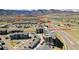 Aerial view showcases community's proximity to shopping, dining, and Waterton Canyon/Chatfield State Park at 8437 Mount Kataka Loop, Littleton, CO 80125