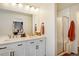 Modern bathroom with double vanity, glass shower, and contemporary finishes at 8437 Mount Kataka Loop, Littleton, CO 80125