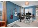 Bright bedroom with two guitars and a modern desk with an adjustable height feature at 8437 Mount Kataka Loop, Littleton, CO 80125