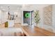 Open-concept living space featuring a modern dining table, white kitchen, and stylish decor creating an inviting atmosphere at 8437 Mount Kataka Loop, Littleton, CO 80125