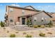 Charming two-story home featuring a stone-accented entrance and drought-resistant landscaping for easy maintenance at 8437 Mount Kataka Loop, Littleton, CO 80125