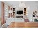 Cozy living room boasts built-in shelves, a fireplace, and large windows for plenty of light at 8437 Mount Kataka Loop, Littleton, CO 80125