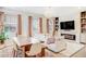 Inviting living room showcasing a fireplace, large screen TV, and comfortable seating at 8437 Mount Kataka Loop, Littleton, CO 80125