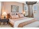 Well-lit main bedroom featuring stylish decor, a cozy bed, and modern furniture at 8437 Mount Kataka Loop, Littleton, CO 80125