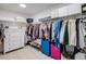 Organized walk-in closet with ample storage and shelving for shoes and accessories at 8437 Mount Kataka Loop, Littleton, CO 80125