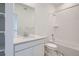Bathroom featuring vanity, large mirror, and shower-tub combo at 8887 San Antonio St, Littleton, CO 80125