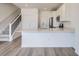 Modern kitchen with white cabinets, stainless steel appliances, and spacious island at 8887 San Antonio St, Littleton, CO 80125
