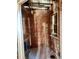 A bathroom's exposed brick, white tile floor, and natural light await renovation at 241 W 4Th Ave, Denver, CO 80223