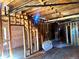 Unfinished living room featuring brick wall, wooden floors, and exposed beam ceiling ready to be customized at 241 W 4Th Ave, Denver, CO 80223