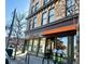 Snooze restaurant exterior with awning, large windows, and outdoor seating creating a welcoming atmosphere at 241 W 4Th Ave, Denver, CO 80223