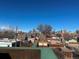 Enjoy the cityscape views from this rooftop terrace, a perfect spot for relaxation at 241 W 4Th Ave, Denver, CO 80223