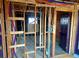 View of a room under construction with exposed plumbing, electrical and wood framing awaiting renovation at 241 W 4Th Ave, Denver, CO 80223