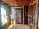 Room featuring hardwood flooring, a glass block window and a purple door under construction at 241 W 4Th Ave, Denver, CO 80223