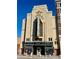 Exterior of the Mayan Theatre showing classic architecture and marquee with current movie listings at 241 W 4Th Ave, Denver, CO 80223