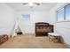 bedroom with crib, teepee, and neutral color scheme at 8261 Delaware St, Denver, CO 80221