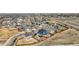 Aerial view of a neighborhood highlighting the house with a firepit in the backyard at 6812 Indian Paintbrush St, Frederick, CO 80530