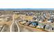 Neighborhood aerial view showing a back yard with fire pit and views of the mountains at 6812 Indian Paintbrush St, Frederick, CO 80530