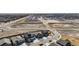Aerial view of neighborhood including a back yard with landscaping and fire pit at 6812 Indian Paintbrush St, Frederick, CO 80530