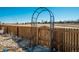 Backyard gate with an iron arch at 6812 Indian Paintbrush St, Frederick, CO 80530