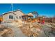 Landscaped backyard with a boat, fire pit area and small deck at 6812 Indian Paintbrush St, Frederick, CO 80530