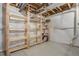 Unfinished basement area with shelving and exposed utilities, ready for customization at 6812 Indian Paintbrush St, Frederick, CO 80530