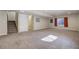 Finished basement with stairs to the left, carpeted floor, and a window at 6812 Indian Paintbrush St, Frederick, CO 80530