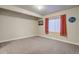 Cozy basement featuring neutral carpet, a window with blinds, and recessed lighting at 6812 Indian Paintbrush St, Frederick, CO 80530
