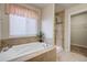 Relaxing bathroom features a soaking tub and a separate tiled shower at 6812 Indian Paintbrush St, Frederick, CO 80530