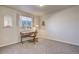Well-lit bedroom with a desk area and large window with outside view at 6812 Indian Paintbrush St, Frederick, CO 80530