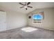 Bright primary bedroom features vaulted ceilings, plush carpeting, and a large window at 6812 Indian Paintbrush St, Frederick, CO 80530