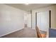 Bedroom with closet and hall access, and carpet at 6812 Indian Paintbrush St, Frederick, CO 80530
