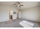 Large bedroom with carpet and access to an ensuite bathroom at 6812 Indian Paintbrush St, Frederick, CO 80530