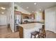 Open kitchen with granite countertops, stainless steel appliances, and a functional island at 6812 Indian Paintbrush St, Frederick, CO 80530