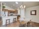 Charming kitchen featuring granite countertops, stainless steel appliances and breakfast bar at 6812 Indian Paintbrush St, Frederick, CO 80530
