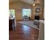 Comfortable living room boasts vaulted ceilings, a fireplace, and access to the backyard at 6812 Indian Paintbrush St, Frederick, CO 80530
