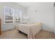 A bright and airy bedroom with 2 large windows and neutral tones at 5899 S Taft Ter, Littleton, CO 80127