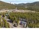 Breathtaking aerial view of the property nestled amidst a forest, showcasing its serene location at 140 Beaver Rd, Idaho Springs, CO 80452