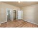 Beige bedroom showcasing laminate flooring, closet and bathroom access, and neutral tones at 140 Beaver Rd, Idaho Springs, CO 80452