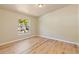 Neutral bedroom featuring laminate flooring, a window, and ample natural light at 140 Beaver Rd, Idaho Springs, CO 80452