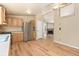 Open-concept kitchen with stainless steel appliances, wood cabinets, and a seamless flow into the adjacent living area at 140 Beaver Rd, Idaho Springs, CO 80452