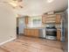 Well-equipped kitchen with stainless steel appliances, ample cabinet space, and wood flooring, perfect for culinary enthusiasts at 140 Beaver Rd, Idaho Springs, CO 80452