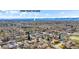 A charming neighborhood with lush trees and beautiful houses, showcasing community charm in Olde Town Arvada at 7017 W 62Nd Pl, Arvada, CO 80003
