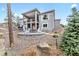Elegant backyard with a cozy fire pit, ideal for entertaining guests and enjoying the outdoors at 445 Panoramic Dr, Monument, CO 80132