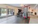 Basement gym and recreation area with a door leading to outdoor seating at 445 Panoramic Dr, Monument, CO 80132